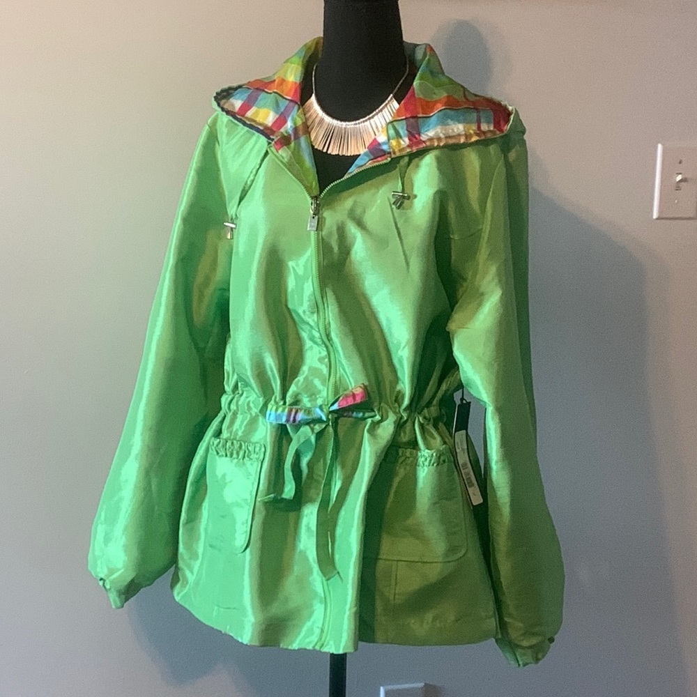 Reversible lime green windbreaker rain jacket.